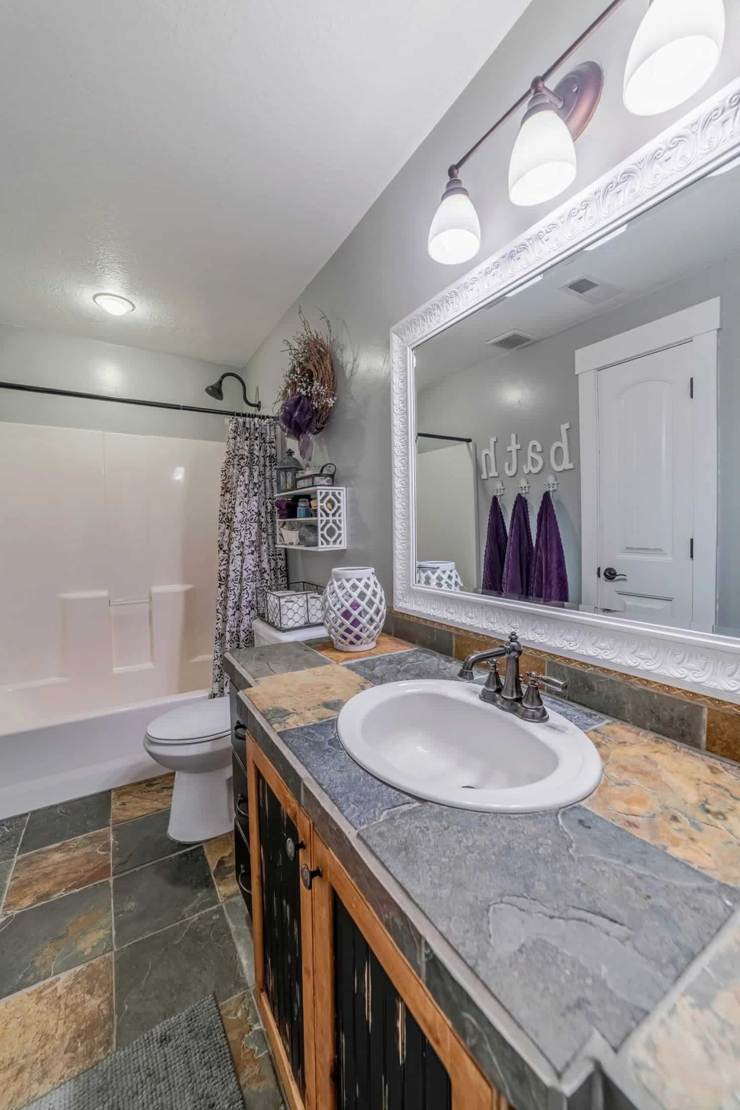 Modern bathroom interior of a house with clean built in bathtub and tiled floor